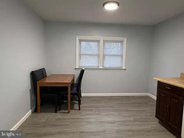 a workspace with furniture and wooden floor