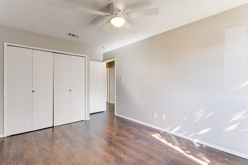 9421 Shipman Street Rowlett, TX 75088 - Photo 18 of 29 a view of an empty room with wooden floor