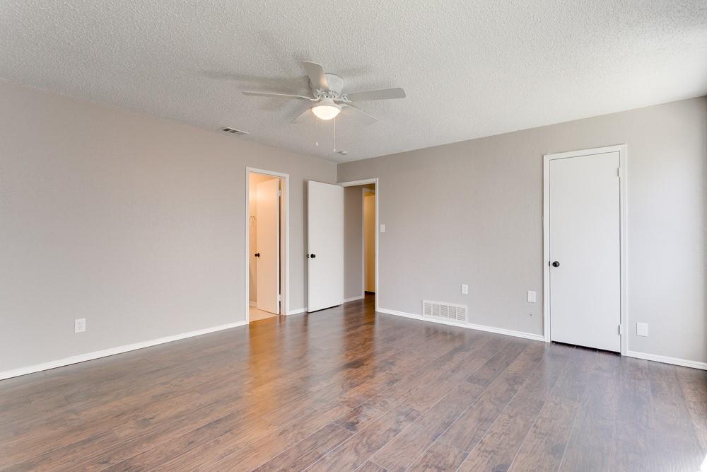 9421 Shipman Street Rowlett, TX 75088 - Photo 22 of 29 a view of an empty room with wooden floor