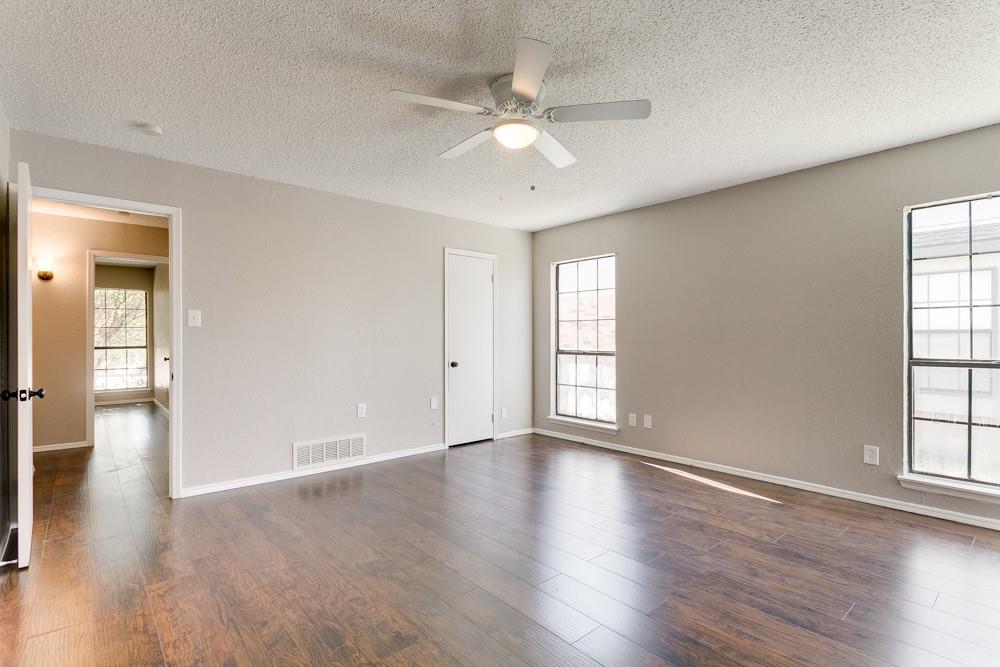 9421 Shipman Street Rowlett, TX 75088 - Photo 23 of 29 wooden floor in an empty room with a window