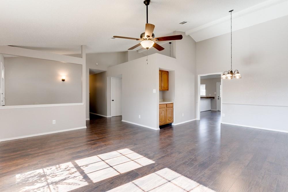 9421 Shipman Street Rowlett, TX 75088 - Photo 3 of 29 a view of empty room with wooden floor and ceiling fan
