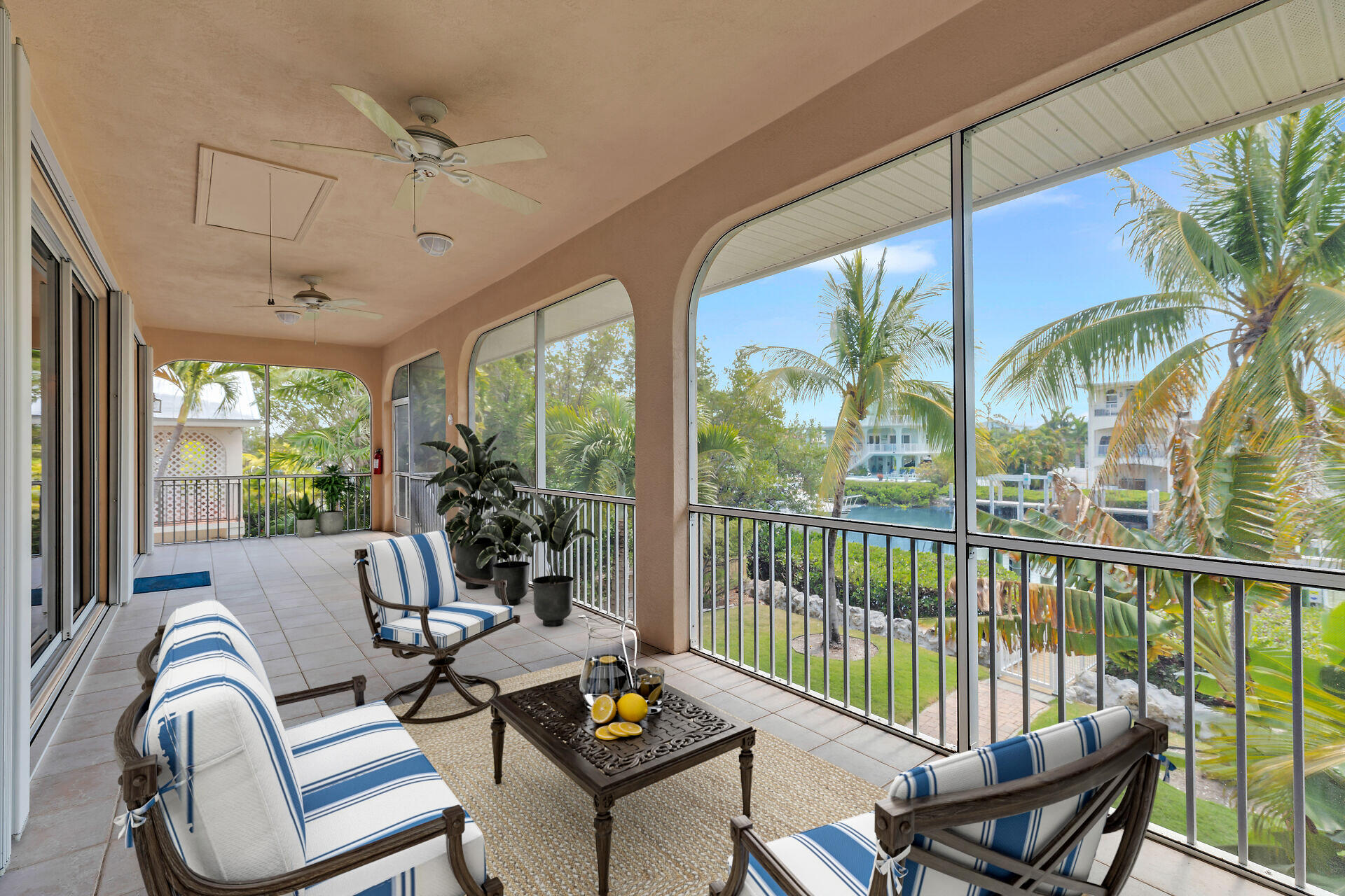 845 Copa D Oro Marathon, FL 33050 - Photo 13 of 41 a living room with furniture and a floor to ceiling window