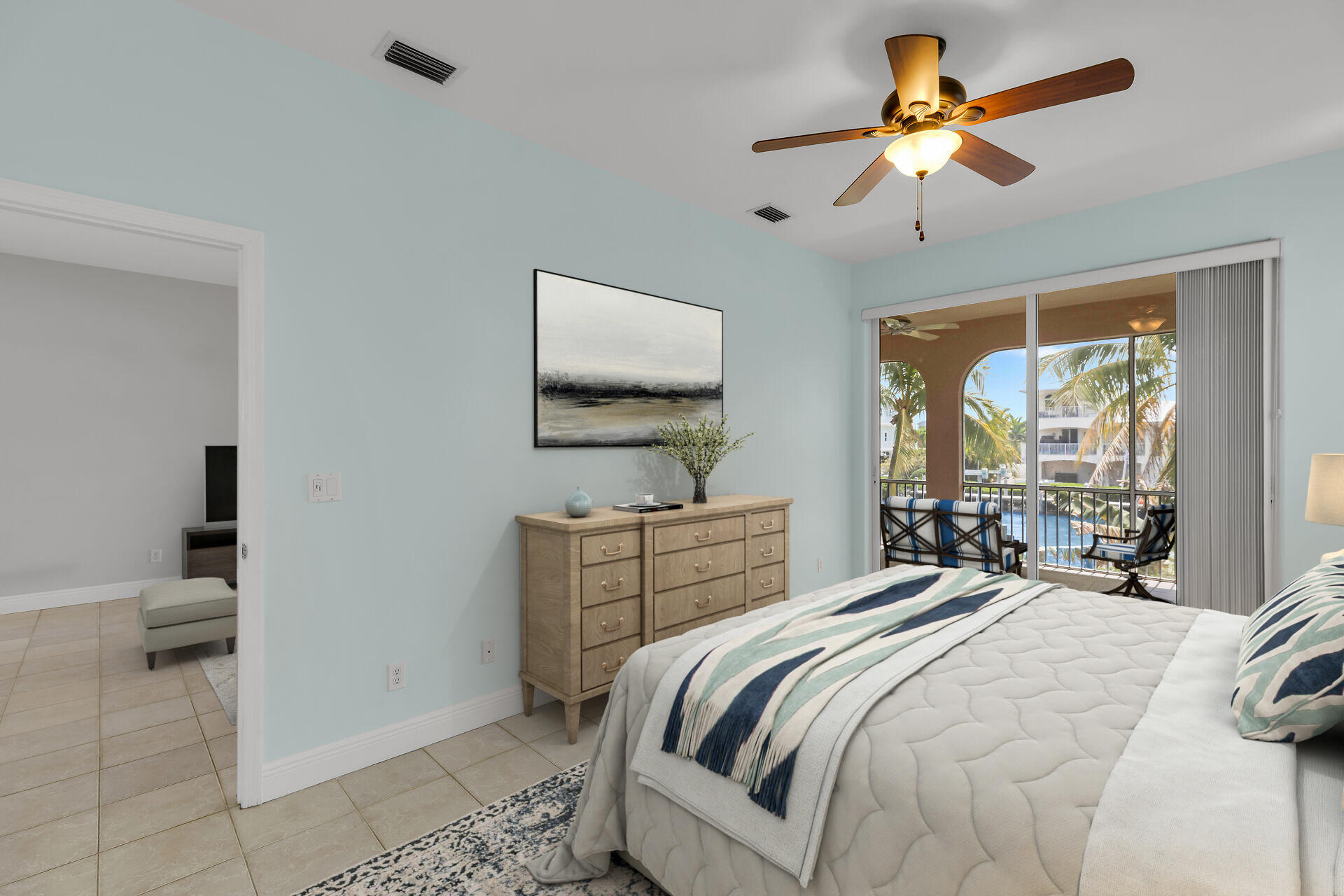 845 Copa D Oro Marathon, FL 33050 - Photo 25 of 41 a bedroom with a bed a window and a chandelier