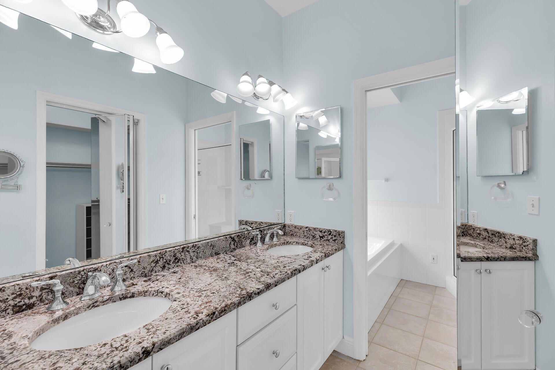 845 Copa D Oro Marathon, FL 33050 - Photo 26 of 41 a bathroom with a granite countertop sink and a mirror