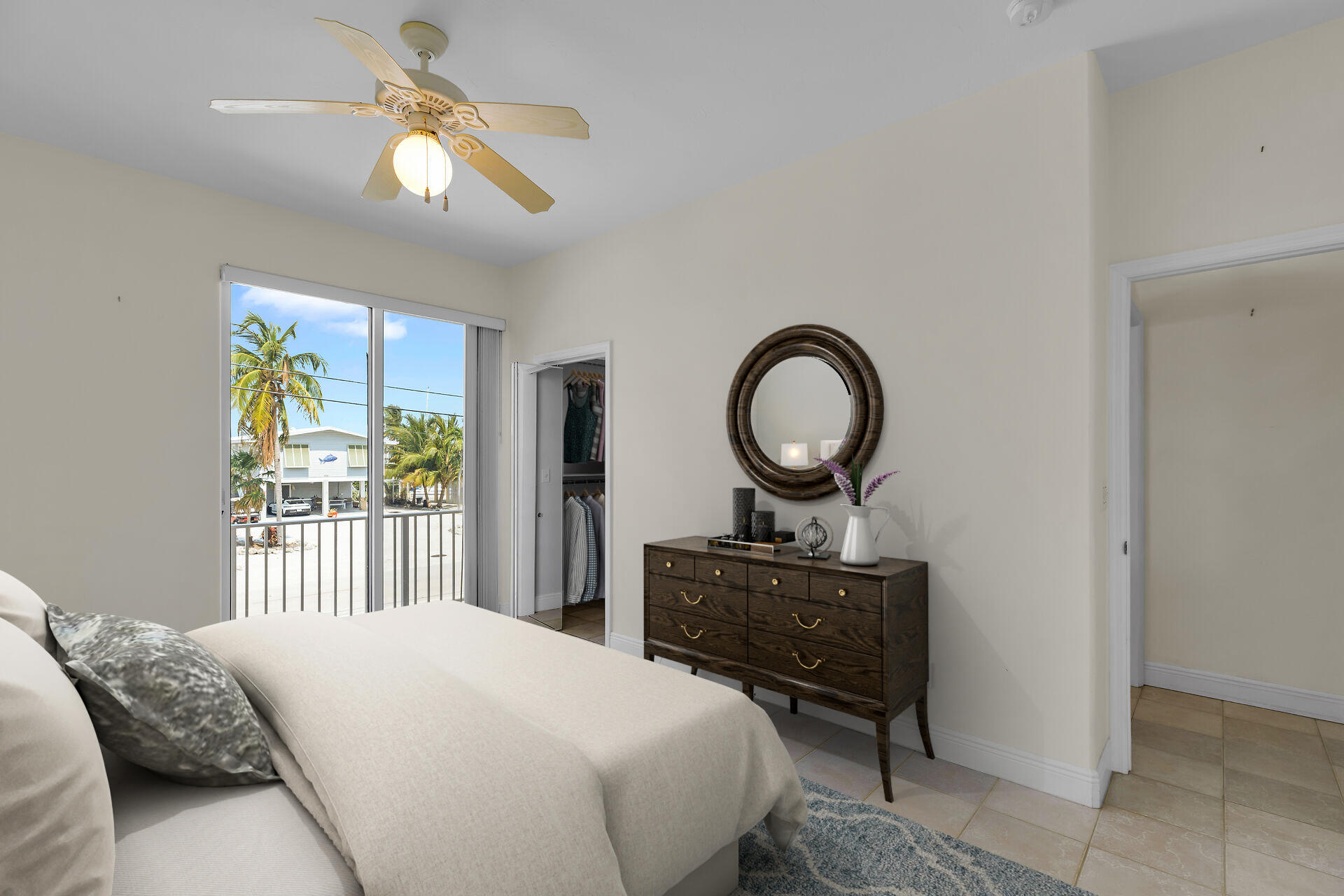 845 Copa D Oro Marathon, FL 33050 - Photo 29 of 41 a bedroom with a bed and a chandelier
