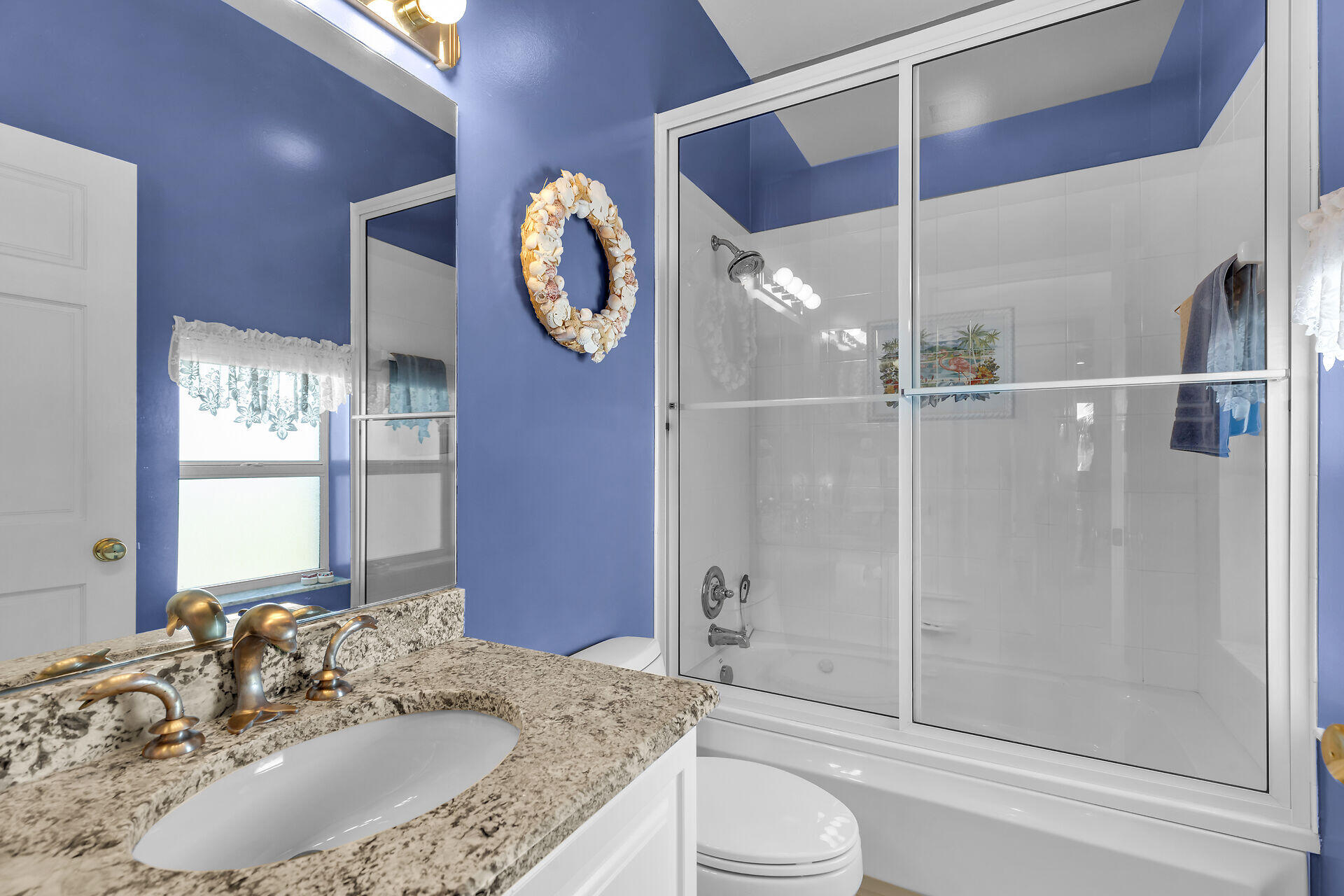 845 Copa D Oro Marathon, FL 33050 - Photo 31 of 41 a bathroom with a granite countertop sink mirror toilet and shower