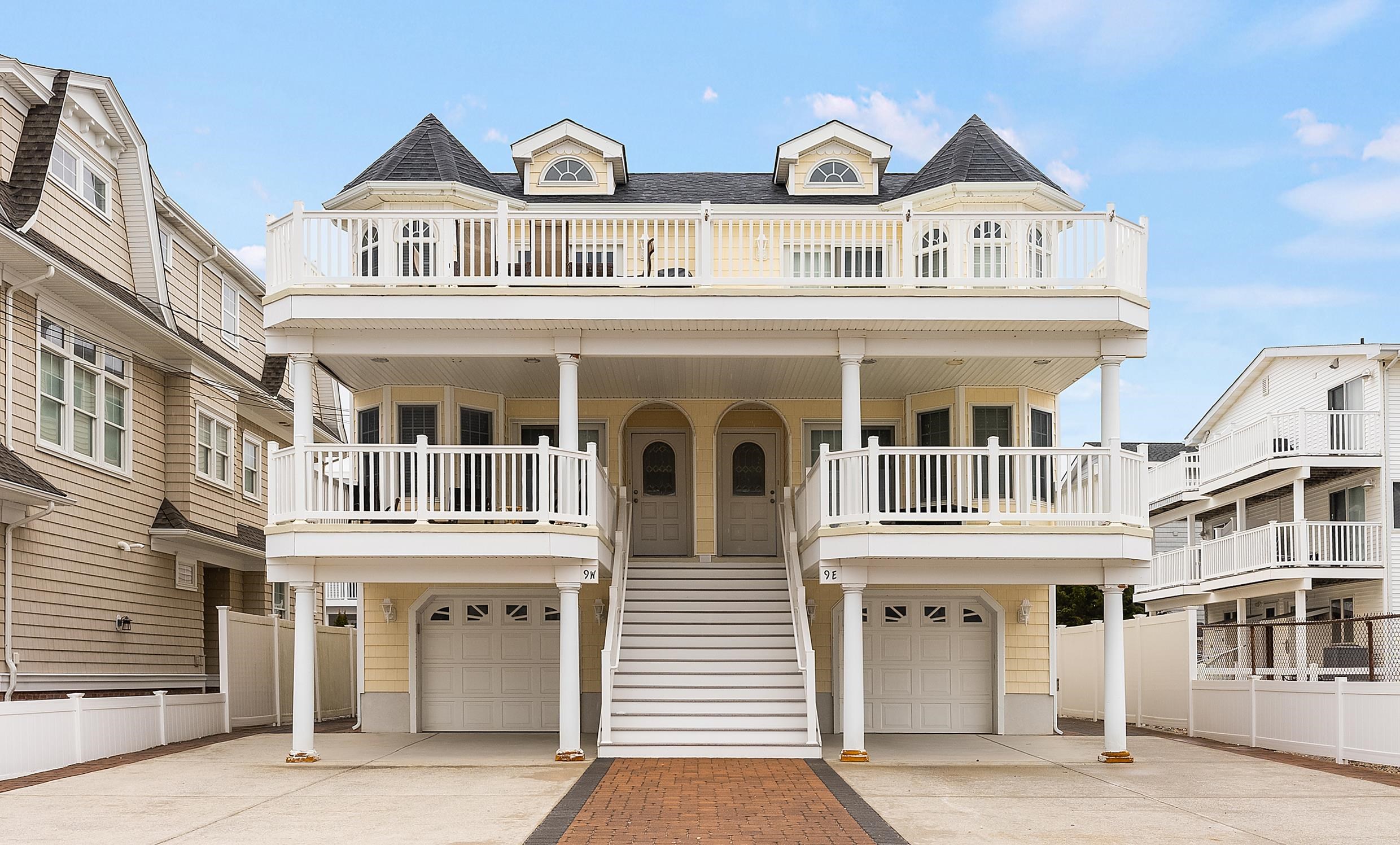 9 78th Street, Unit WEST Sea Isle City, NJ 08243 - Photo 1 of 24 a front view of residential houses with street