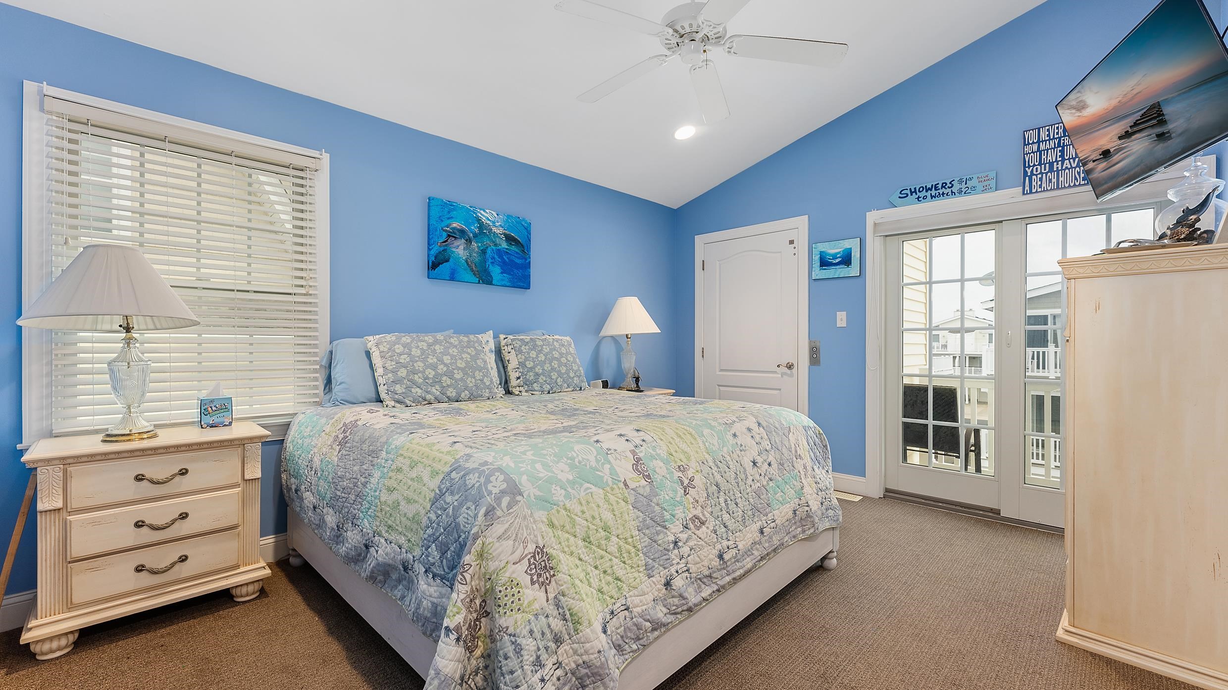9 78th Street, Unit WEST Sea Isle City, NJ 08243 - Photo 11 of 24 a bedroom with a bed and a window