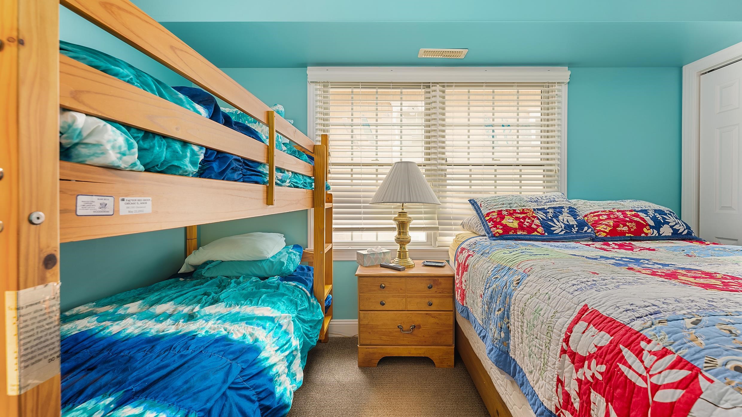 9 78th Street, Unit WEST Sea Isle City, NJ 08243 - Photo 18 of 24 a bedroom with a bed and a window