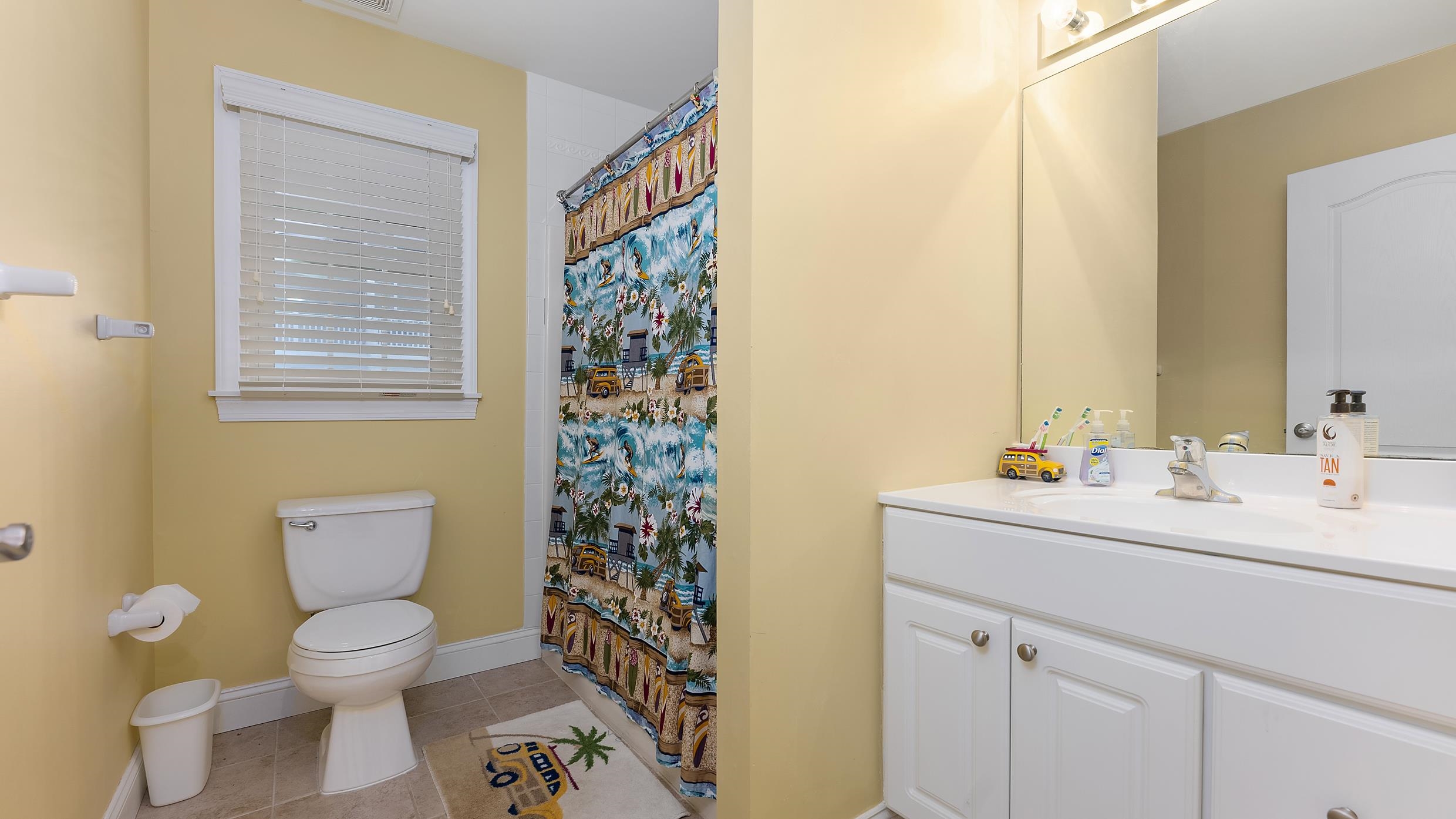 9 78th Street, Unit WEST Sea Isle City, NJ 08243 - Photo 20 of 24 a bathroom with a toilet a sink and a mirror