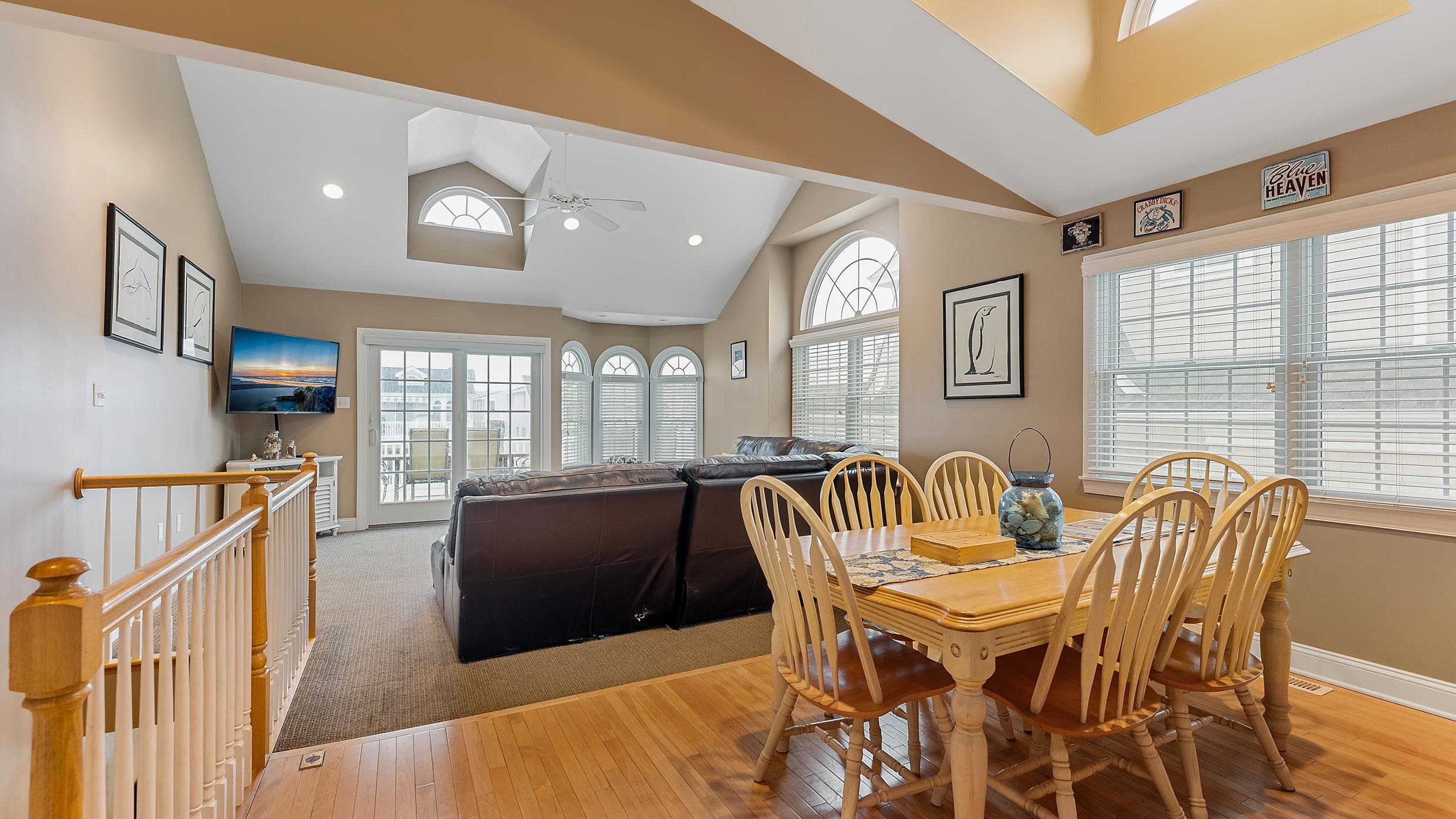 9 78th Street, Unit WEST Sea Isle City, NJ 08243 - Photo 5 of 24 a view of a dining room with furniture and windows