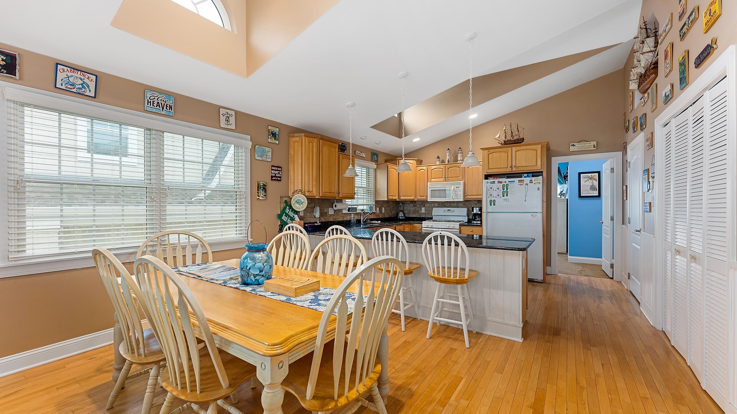 9 78th Street, Unit WEST Sea Isle City, NJ 08243 - Photo 6 of 24 a dining room with furniture water view and large windows