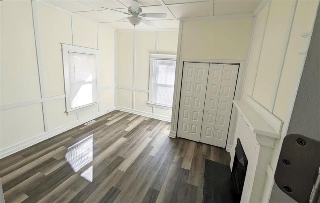 208 Hampton Street Iva, SC 29655 - Photo 12 of 19 Bright and inviting room features stylish flooring and a classic fireplace.
