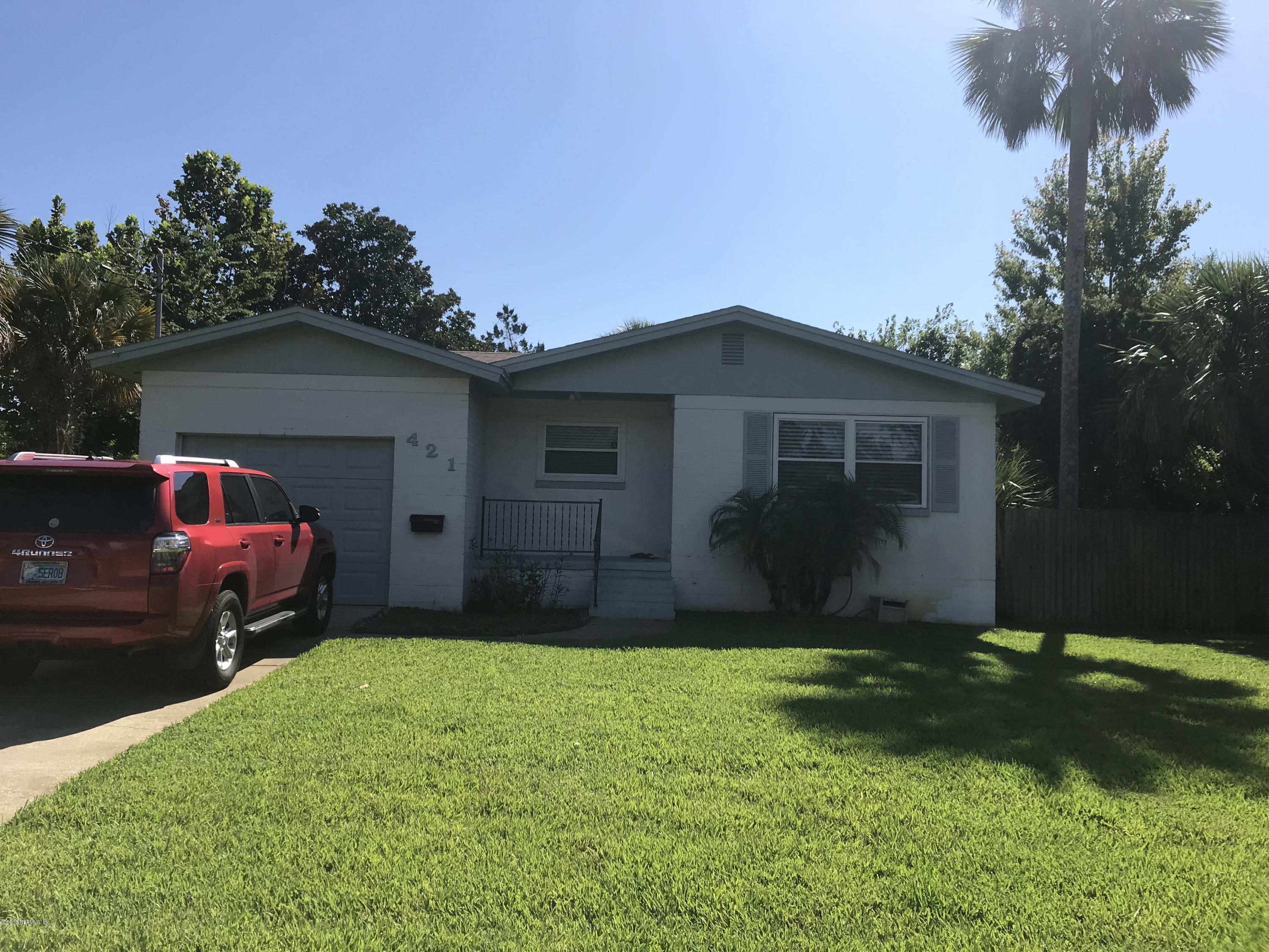 421 Skate Road Atlantic Beach, FL 32233 - Photo 4 of 18 a front view of a house with a yard