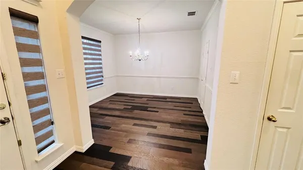 a view of entryway with wooden floor