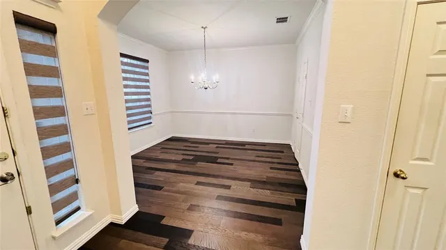 a view of entryway with wooden floor