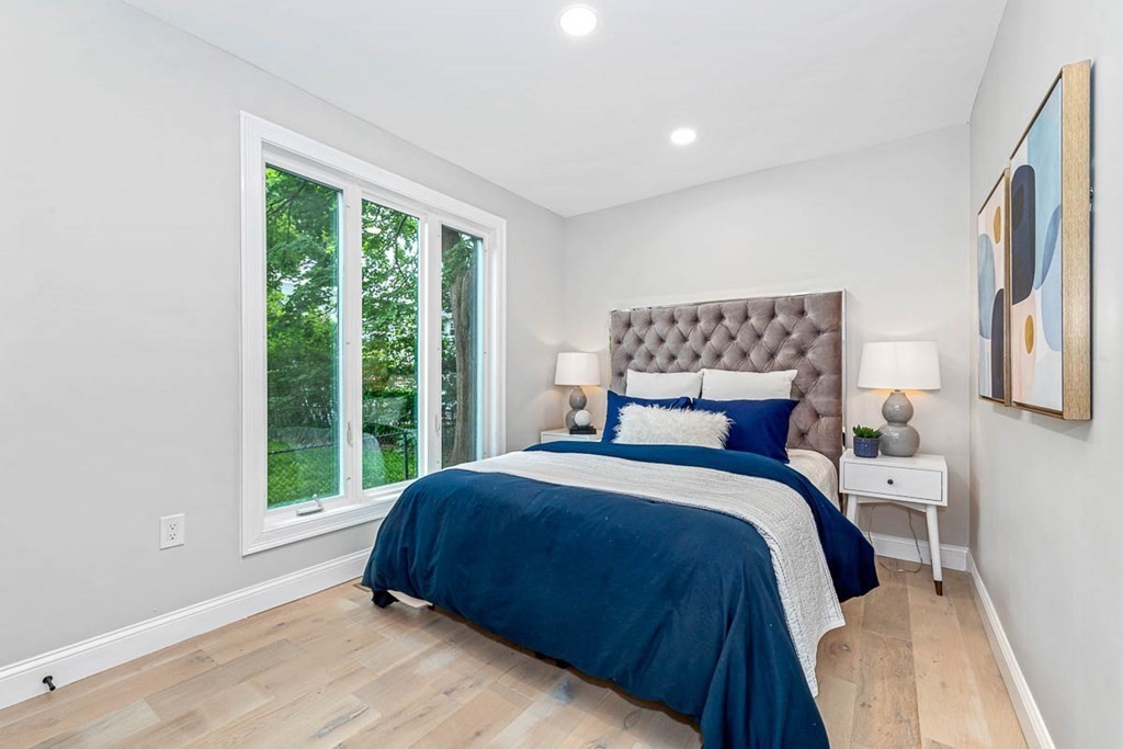 36-38 Johnswood Road Boston, MA 02131 - Photo 12 of 42 a bedroom with a large bed and a large window