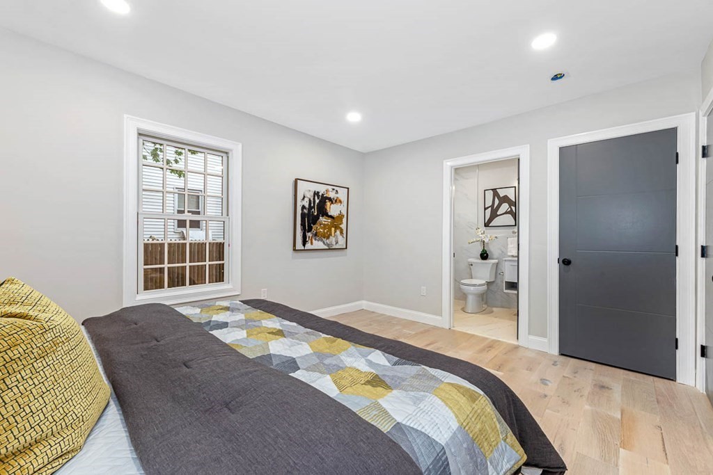 36-38 Johnswood Road Boston, MA 02131 - Photo 15 of 42 a bedroom with a bed and a window