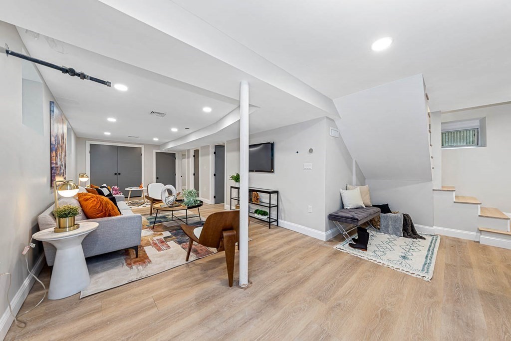 36-38 Johnswood Road Boston, MA 02131 - Photo 17 of 42 a living room with furniture and a wooden floor