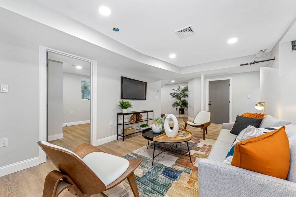 36-38 Johnswood Road Boston, MA 02131 - Photo 19 of 42 a living room with furniture and a flat screen tv