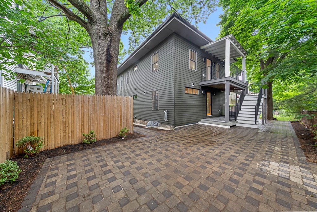 36-38 Johnswood Road Boston, MA 02131 - Photo 2 of 42 a front view of a house with a yard and garage