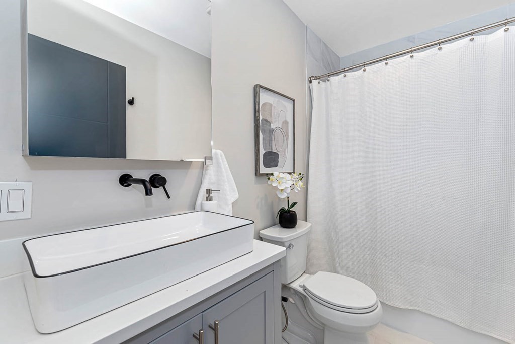 36-38 Johnswood Road Boston, MA 02131 - Photo 22 of 42 a bathroom with a sink a toilet and shower