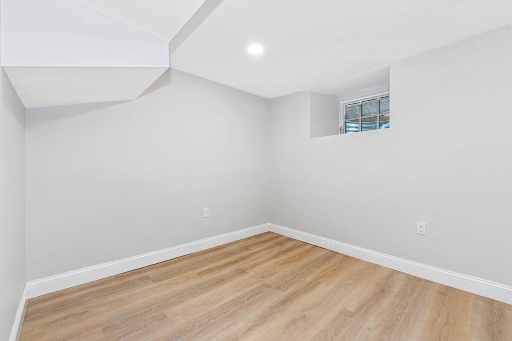 36-38 Johnswood Road Boston, MA 02131 - Photo 23 of 42 a view of a room with wooden floor and white walls