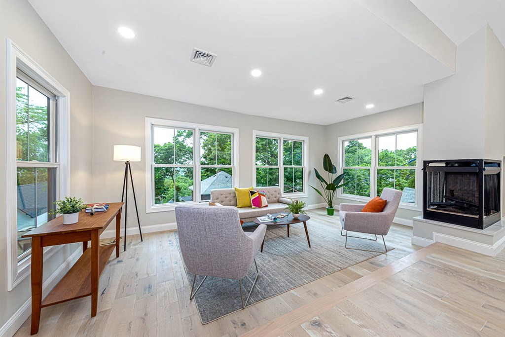 36-38 Johnswood Road Boston, MA 02131 - Photo 27 of 42 a living room with furniture and a fireplace