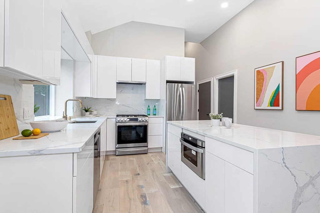 36-38 Johnswood Road Boston, MA 02131 - Photo 34 of 42 a kitchen with stainless steel appliances a stove a sink dishwasher and a refrigerator