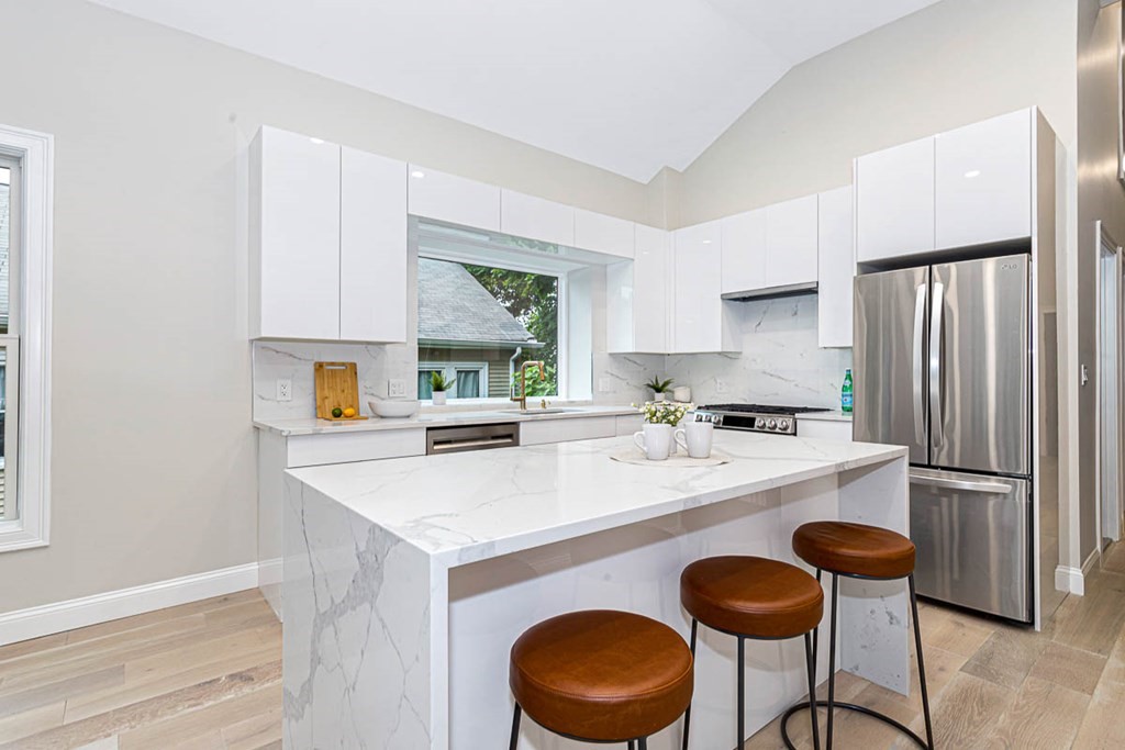 36-38 Johnswood Road Boston, MA 02131 - Photo 35 of 42 a kitchen with stainless steel appliances granite countertop a sink a refrigerator and a stove