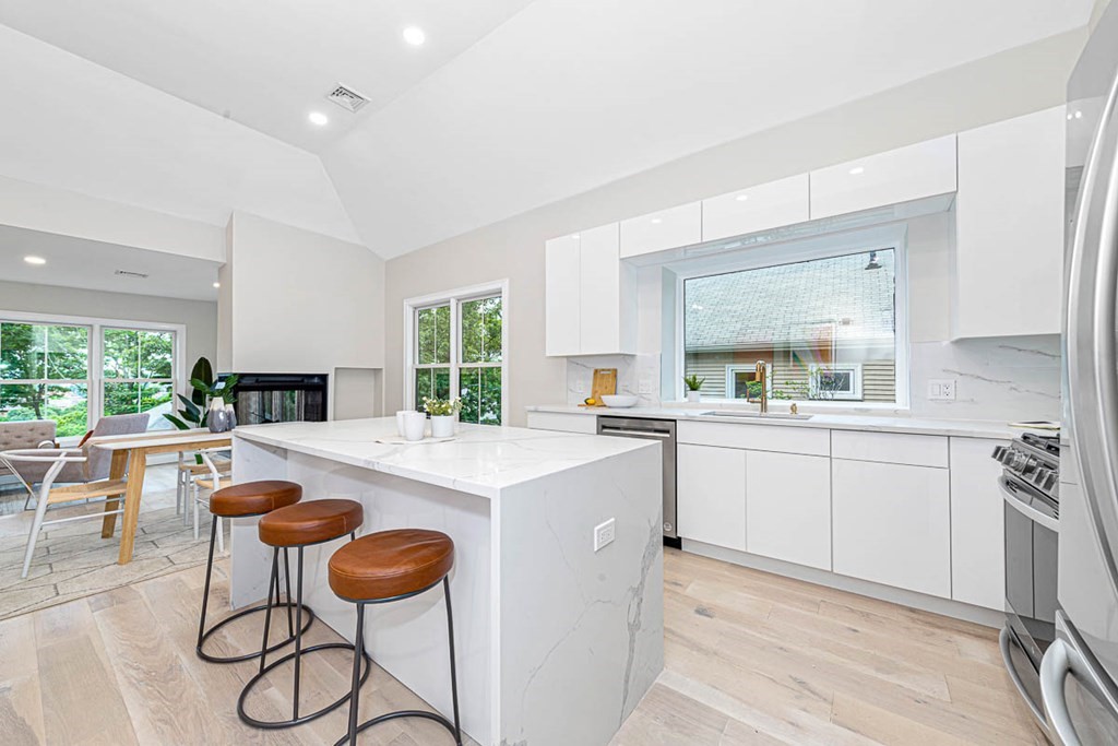 36-38 Johnswood Road Boston, MA 02131 - Photo 36 of 42 a kitchen with furniture a center island and appliances