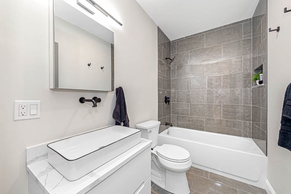 36-38 Johnswood Road Boston, MA 02131 - Photo 39 of 42 a bathroom with a white bath tub a toilet and a shower