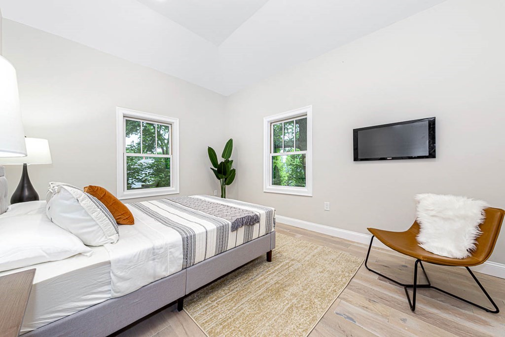 36-38 Johnswood Road Boston, MA 02131 - Photo 40 of 42 a bedroom with a bed and a chair