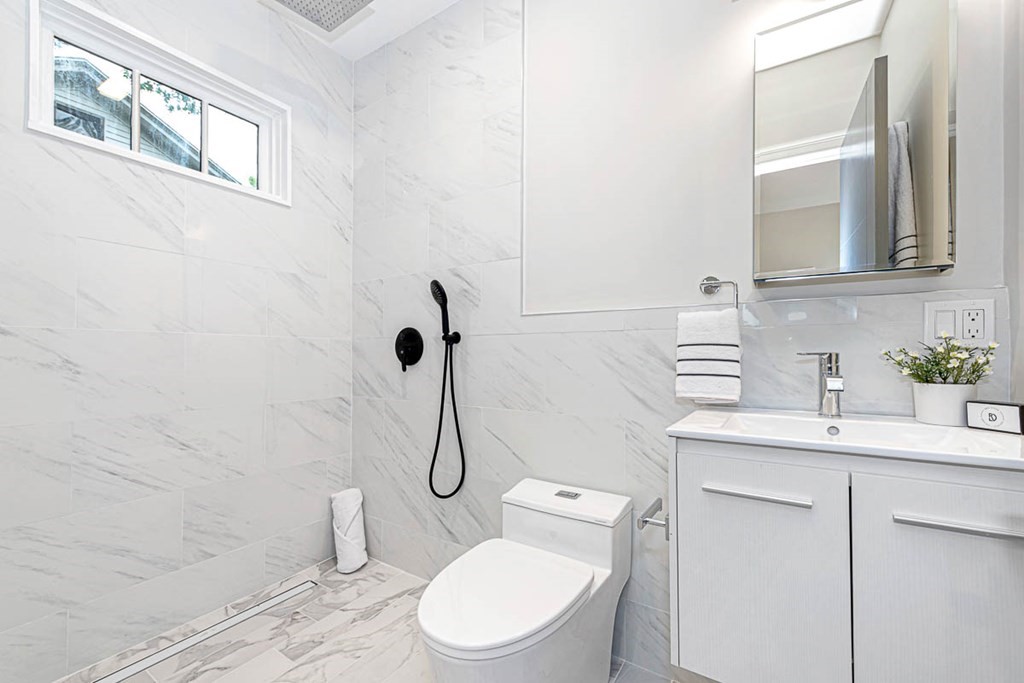 36-38 Johnswood Road Boston, MA 02131 - Photo 42 of 42 a bathroom with a toilet sink vanity granite and shower