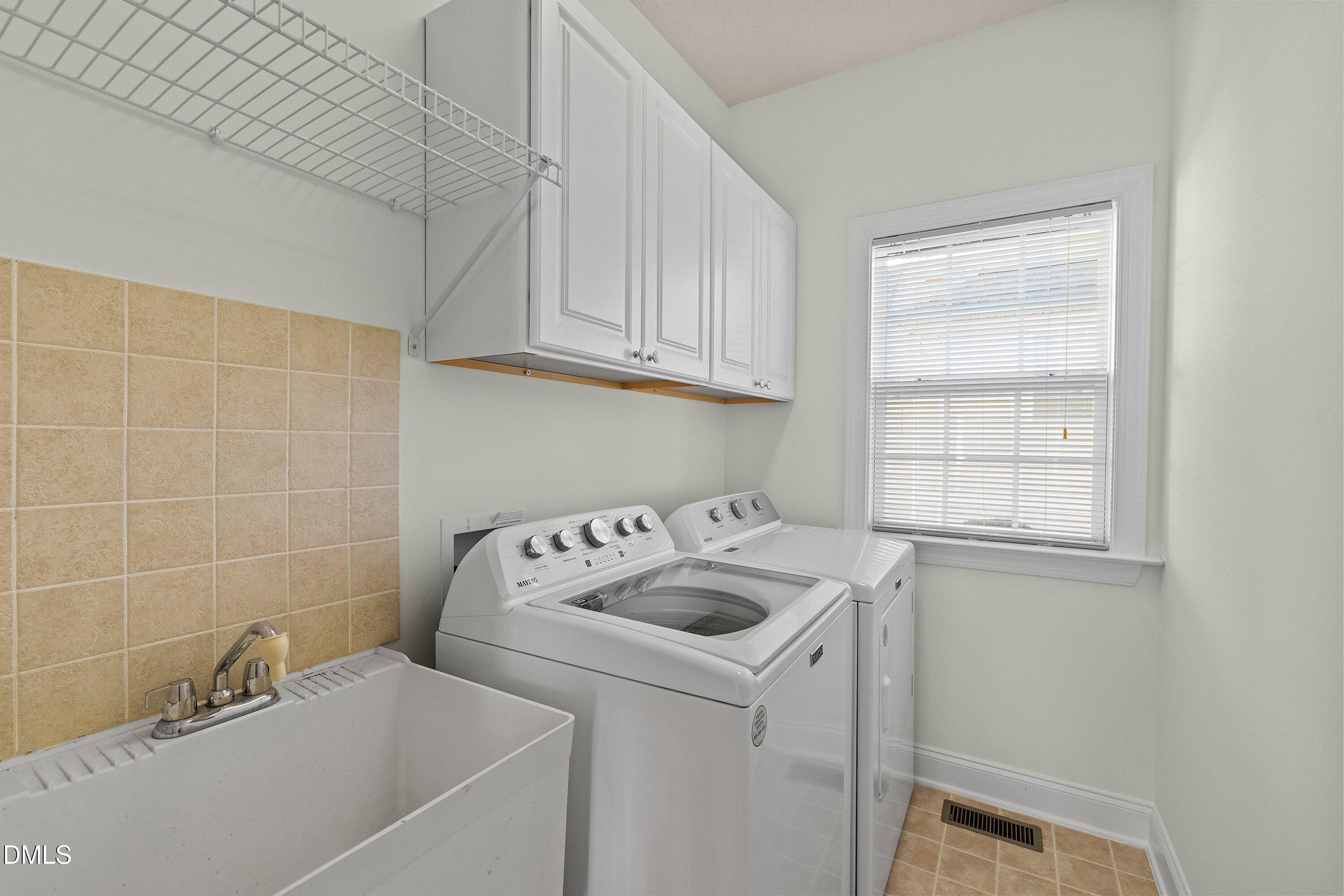 105 Rockport Ridge Way Cary, NC 27519 - Photo 22 of 43 a bathroom with a sink and cabinets