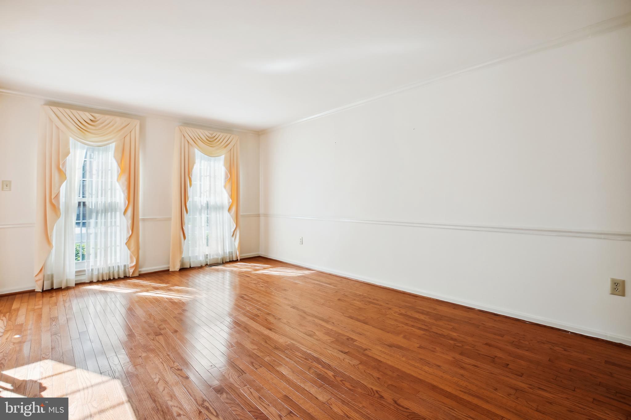 13112 Riviera Terrace Silver Spring, MD 20904 - Photo 16 of 72 Living room with floor to ceiling windows