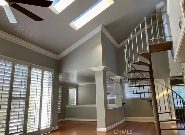 a view of entryway with wooden floor and stairs