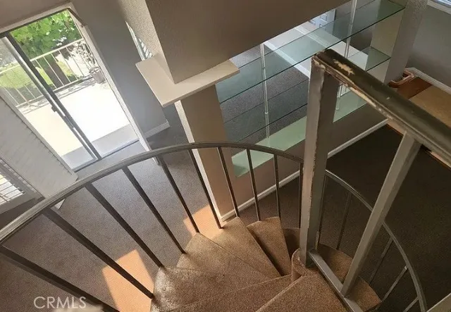 a view of tennis court with chairs