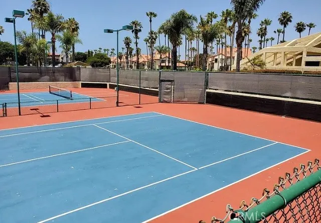 a bathroom with a granite countertop shower a mirror and a sink