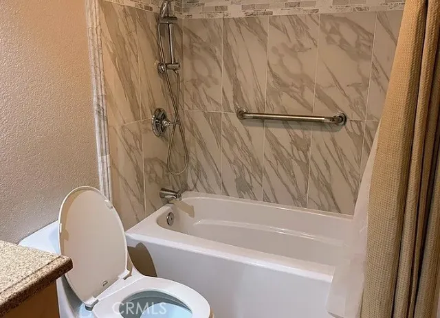 a bathroom with a sink and toilet