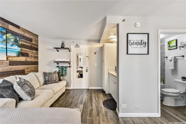 a living room with furniture and a rug