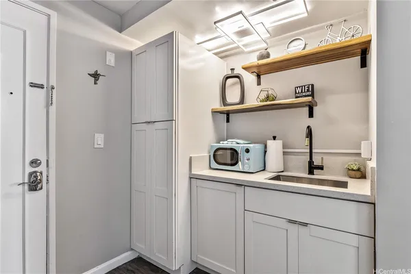 a kitchen with a refrigerator and cabinets