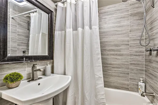 a bathroom with a sink and a bathtub