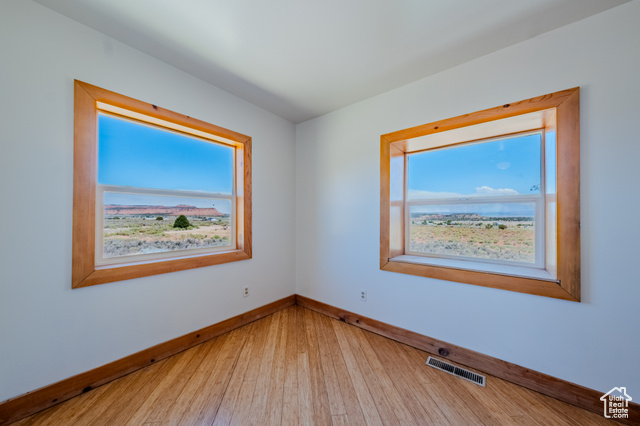 6178 East Zion Road Kanab, UT 84741 - Photo 30 of 48 Spare room featuring wood-type flooring and baseboards