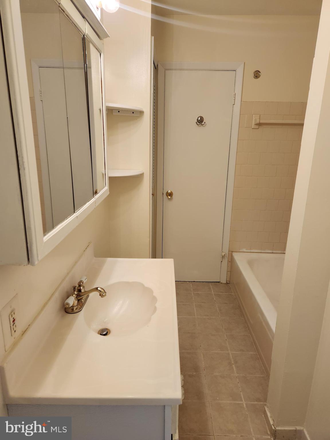 8509 Imperial Drive, Unit 7B Laurel, MD 20708 - Photo 24 of 36 a bathroom with a sink and a tub