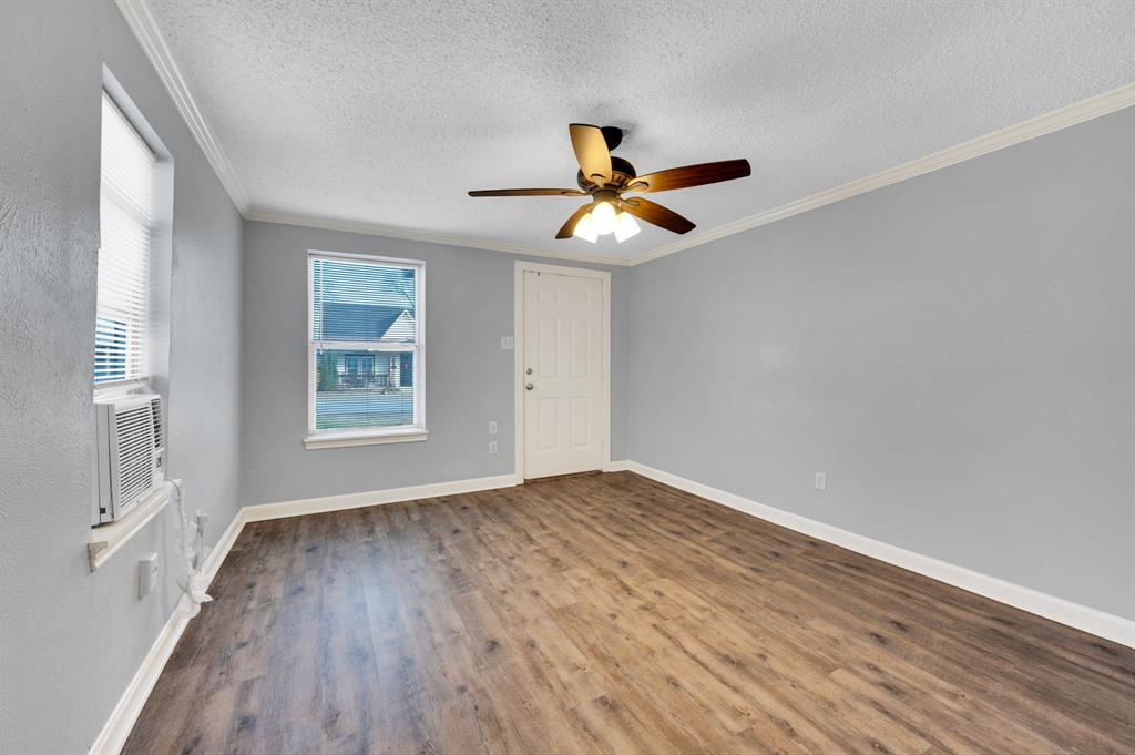 412 East Avenue F Midlothian, TX 76065 - Photo 8 of 12 a view of empty room with wooden floor and fan