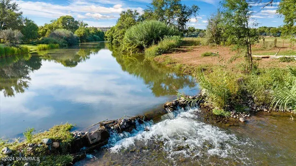 a view of a lake with a yard