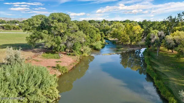 a view of a lake with a yard