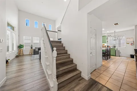 a view of a hallway view with wooden floor and staircase