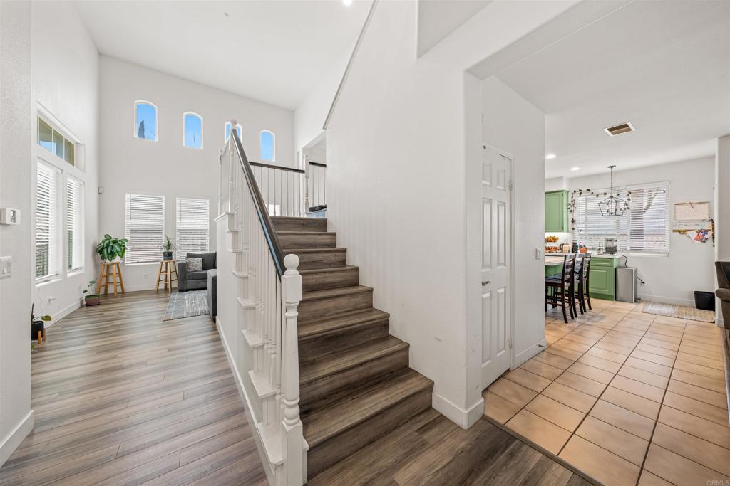 2007 Pleasant Waters Court Spring Valley, CA 91977 - Photo 11 of 22 a view of a hallway view with wooden floor and staircase